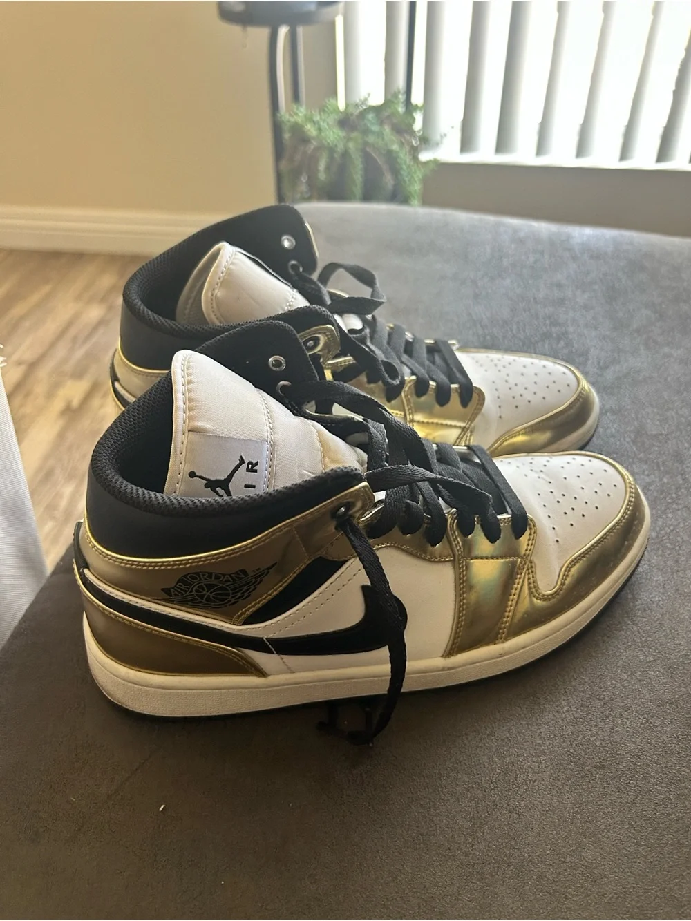 Jordan White, Black & Metallic Gold High-Top Sneakers